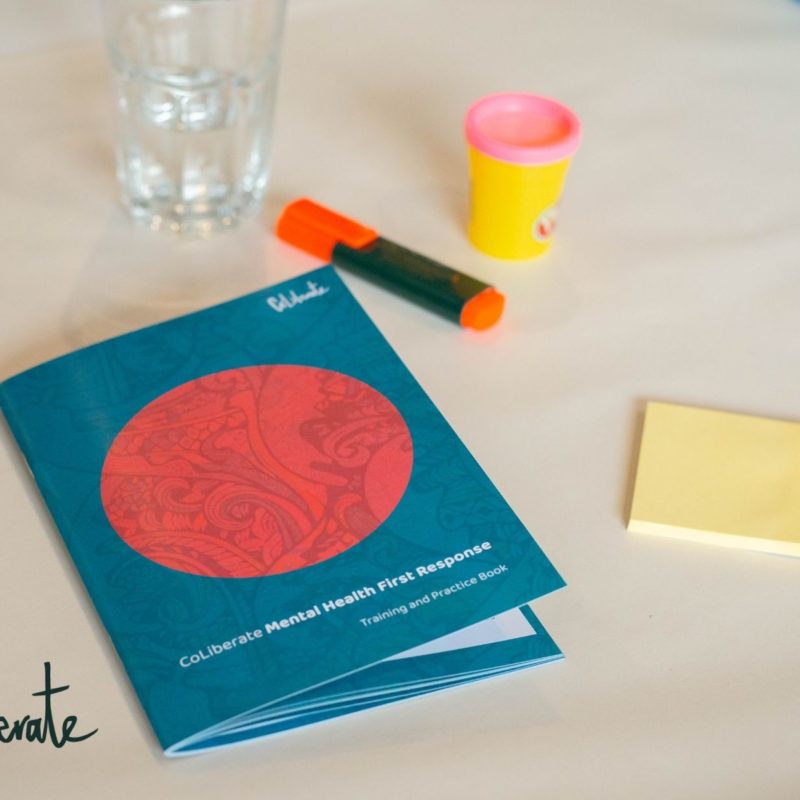 A MHFR booklet on top of a table with a highlighter